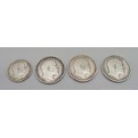 Four coins, a 1903 sixpence and three shillings, 1902, 1907 and 1908