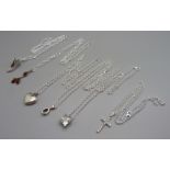 Six silver chains, five silver pendants and a cross pendant, total weight 46g