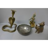 A Thai bronze figure of a musician, an Indian brass Cobra candlestick, an elephant and a brass bowl