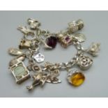 A silver charm bracelet, 64g