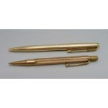 A hallmarked 9ct gold pencil, total weight 23.7g, with initials, and a plated Parker pen, pen dented