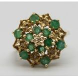 A 9ct gold, twelve stone emerald and seven stone diamond cluster ring, 3.4g, N