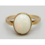 A 9ct gold and opal ring, 2.2g, P, opal approximately 8mm x 10mm and with small chip to the edge