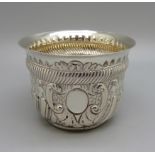 An embossed silver bowl by Charles Stuart Harris, London 1918, 75g, 74mm diameter