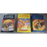 Three Harry Potter first edition books