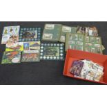 A collection of cigarette cards, some early 20th Century, Historic car tokens, tea cards, etc.