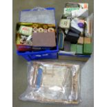 Two boxes of sewing items including spare parts for Singer and Jones' sewing machines, buttons