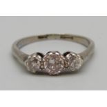 A white metal set three stone diamond ring, 2.7g, O, centre stone approximately 0.4ct diamond weight