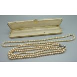 Two faux pearl necklaces, one with 9ct gold fastener