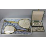 A cased set of apostle spoons and a Rococo vanity set, boxed