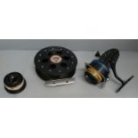 A machine made fishing reel and a Mitchell 300A fishing reel with a spare spool