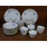 A Carl Tielsch circa 1900 German tea set including bread and butter plates, a sugar bowl, a milk