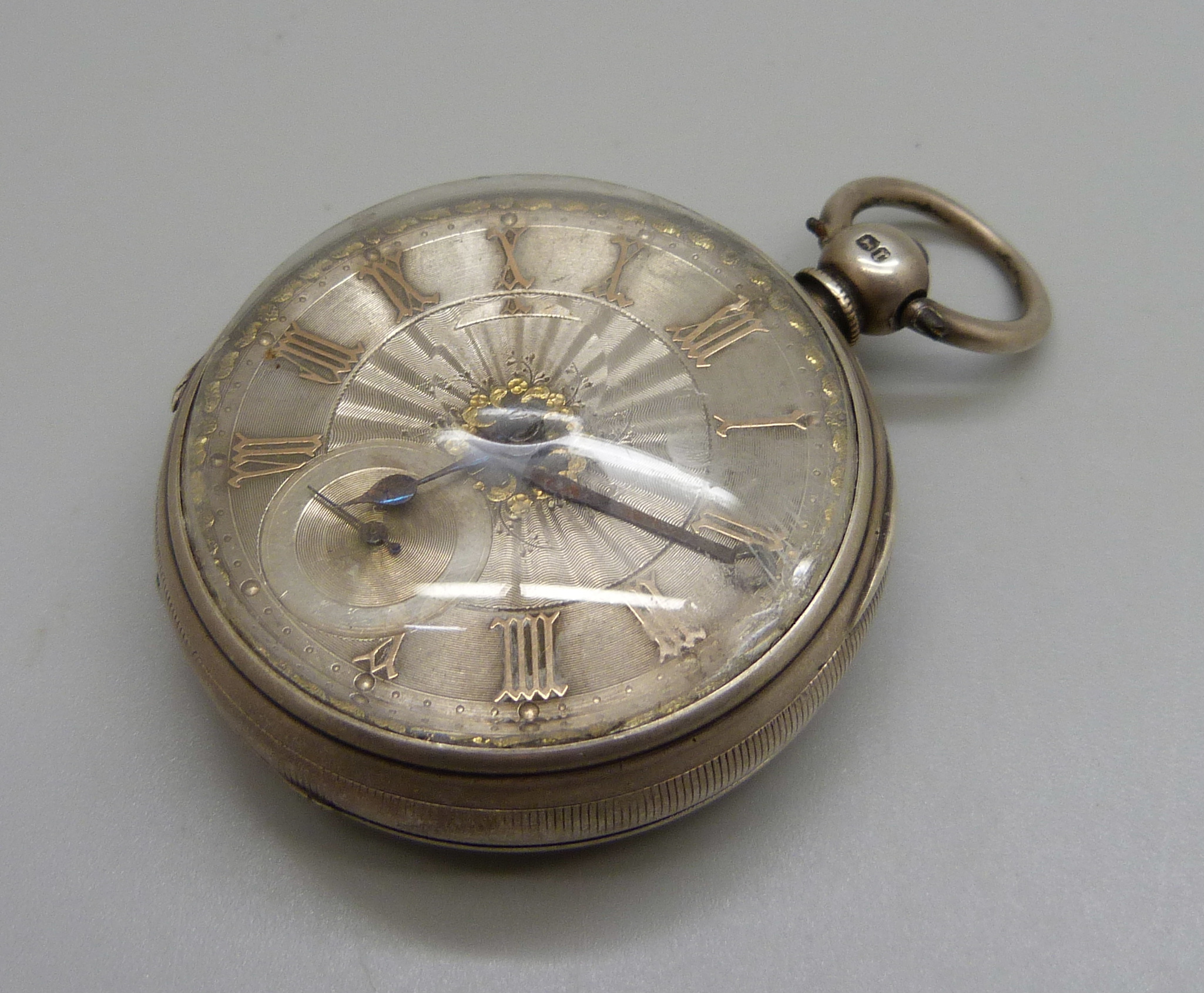 A silver cased fusee pocket watch with silver dial and raised gold Roman numerals, the movement