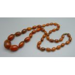 An amber coloured bead necklace