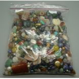 A large quantity of semi precious gemstone beads and glass beads