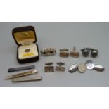 Silver cufflinks and tie-clips