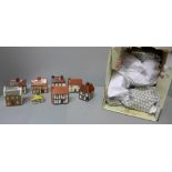 A collection of Mudlen End Studio pottery model houses