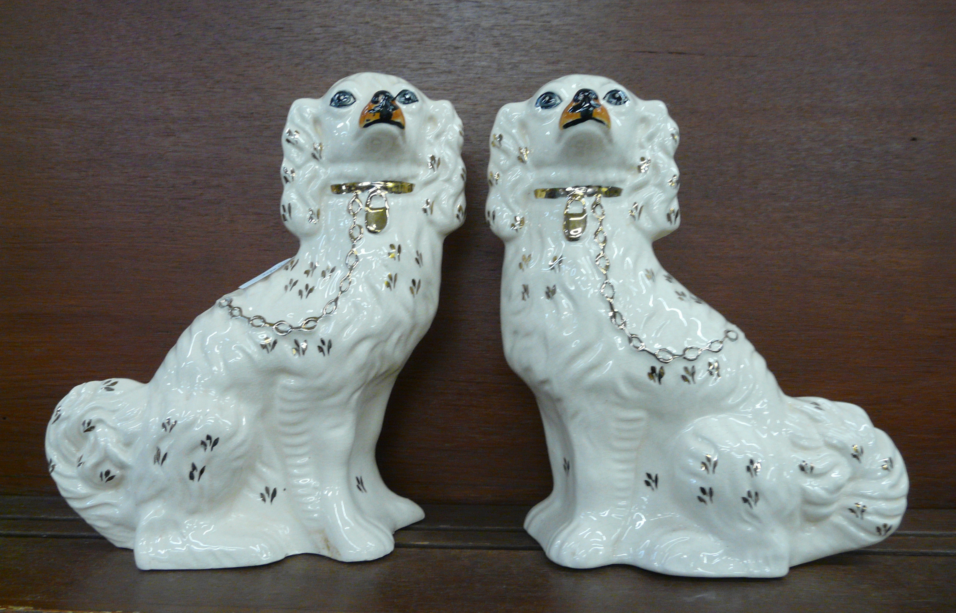 A pair of Staffordshire Spaniels, 30cm