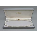 A pearl necklace on a 9ct gold clasp