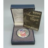 A 1999 American Eagle silver dollar, one Troy ounce .999 fine silver, cased