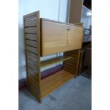 A Staples teak Ladderax room divider