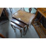 A carved oak coal bin and a walnut nest of tables