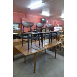 A teak extending dining table and three chairs