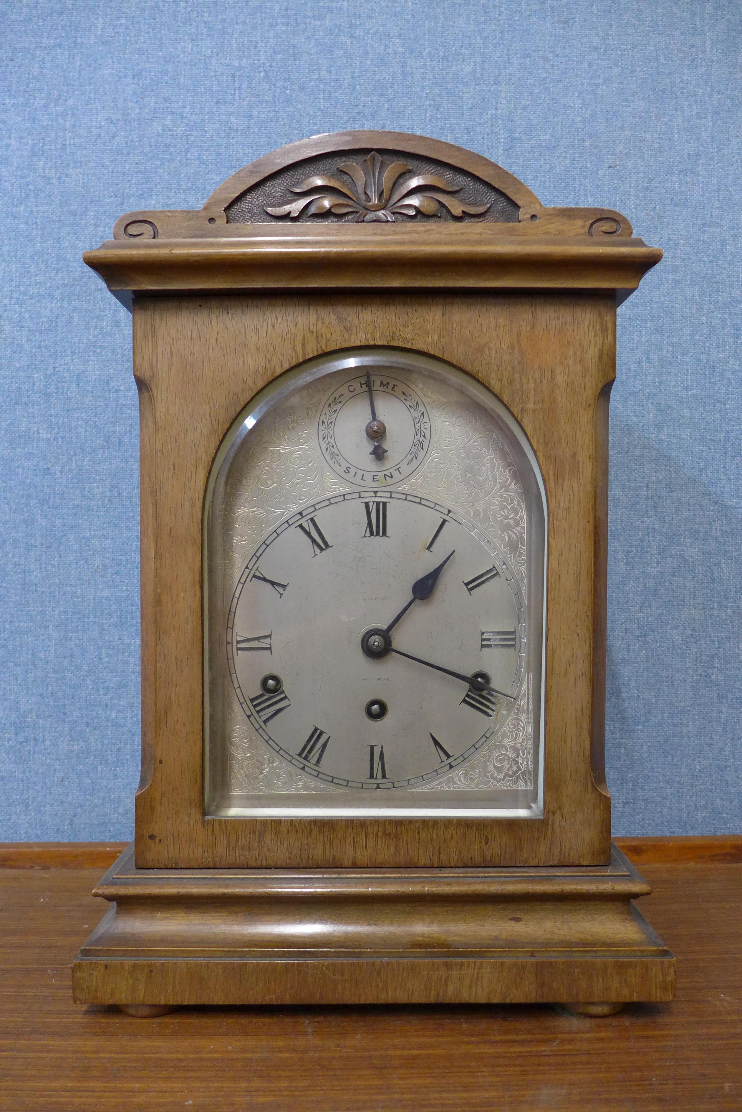 A late 19th Century German Wurttemburg carved walnut bracket clock