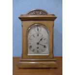 A late 19th Century German Wurttemburg carved walnut bracket clock