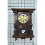 A small 19th Century walnut Vienna wall clock