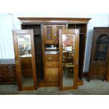 A Victorian carved walnut combination wardrobe, a/f