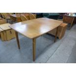 A Meredew teak extending dining table