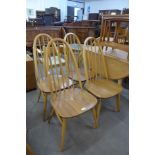 A set of four Ercol Blonde elm and beech Quaker chairs