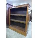 A Victorian walnut open bookcase