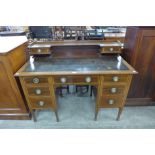 An Edward VII inlaid mahogany desk