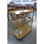 An Ercol Blonde elm and beech Windsor trolley