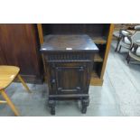 A Jacobean Revival oak pot cupboard