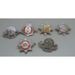 Three Nottinghamshire fire service badges, one other and two St. John Ambulance badges