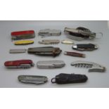 A collection of fifteen pocket knives including two WWII and Swiss Army