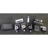 A collection of cameras including Polaroid and folding and spy camera (9)