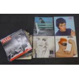 A box of mixed LP records and 12" singles including Bryan Ferry, Eurythmics, B.A.D., Elvis