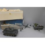 Three boxes of plastic German army soldiers, tank and field gun