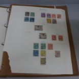 An album of GB stamps including early 20th century inverted and revised and mounted mint and 19th