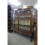 An early 20th Century mahogany bow front display cabinet