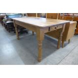 A Victorian style pine single drawer farmhouse kitchen table