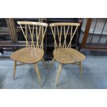 A pair of Ercol Blonde elm and beech 376 model candlestick chairs