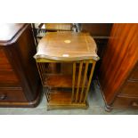 An Edward VII inlaid mahogany revolving bookcase