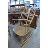 An Ercol Blonde elm and beech Chairmakers armchair