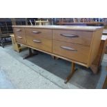 An Austin Suite teak six drawer sideboard