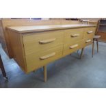 A teak six drawer sideboard